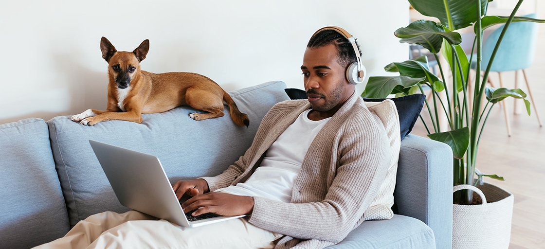 man-with-laptop-on-couch